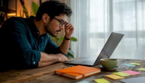 Marketing analyst reviewing dashboard metrics at office desk