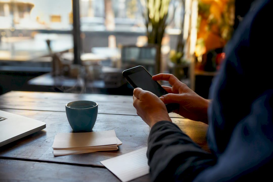 Hands holding smartphone for directory audit