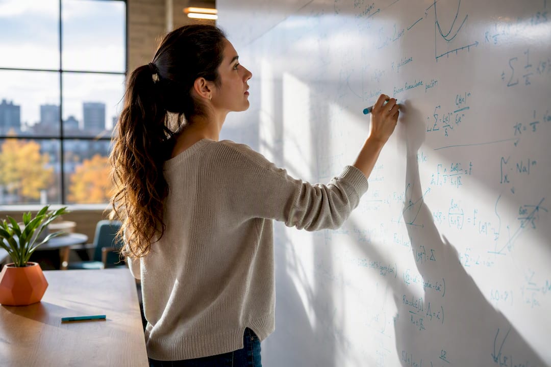 Hand writing statistical model on glass board