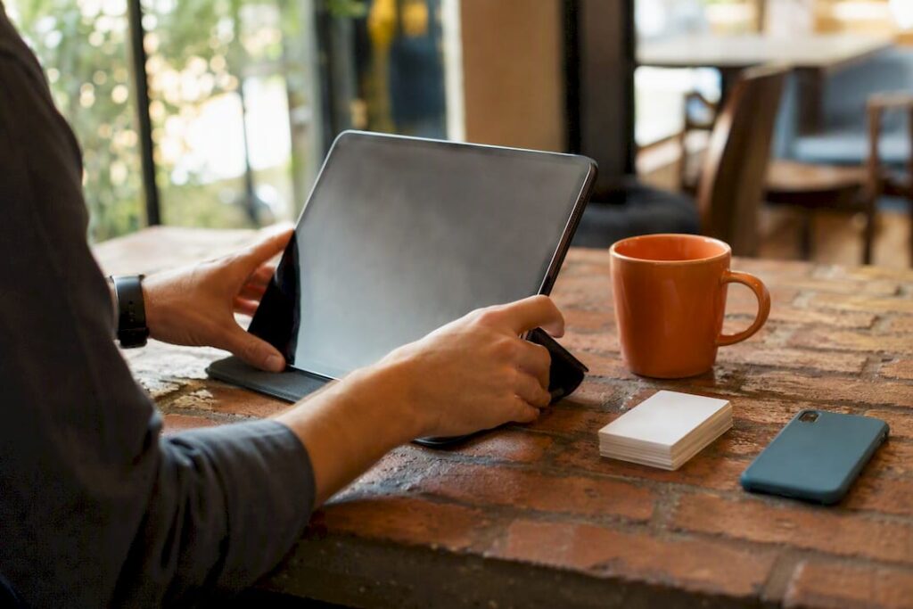 Hands adjusting smartphone for landing page view