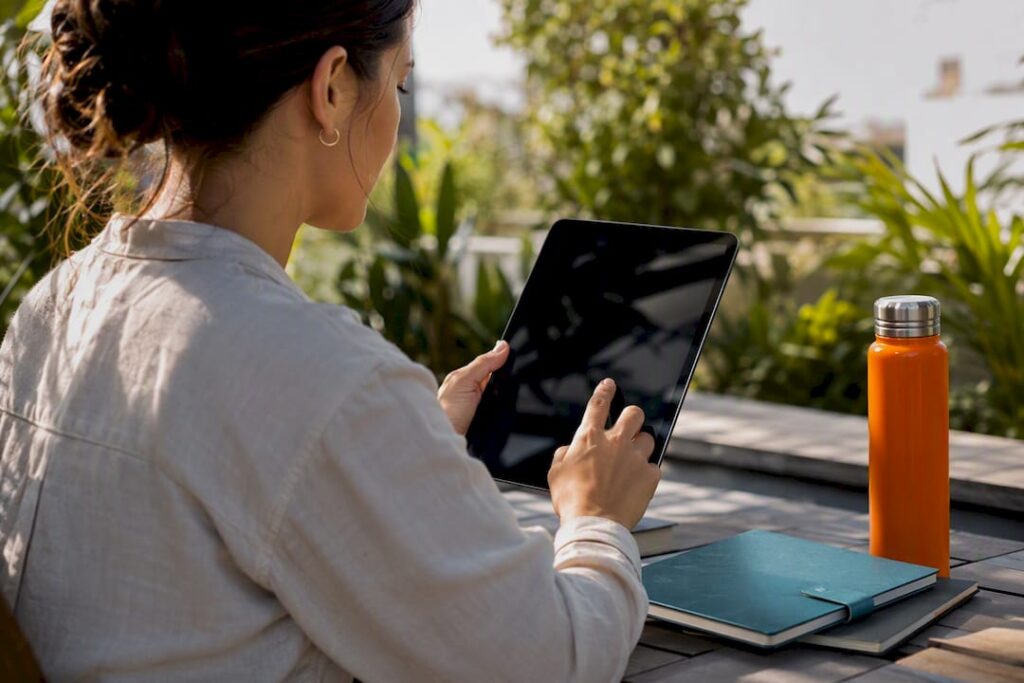 Hands adjusting KPI charts in agency workspace
