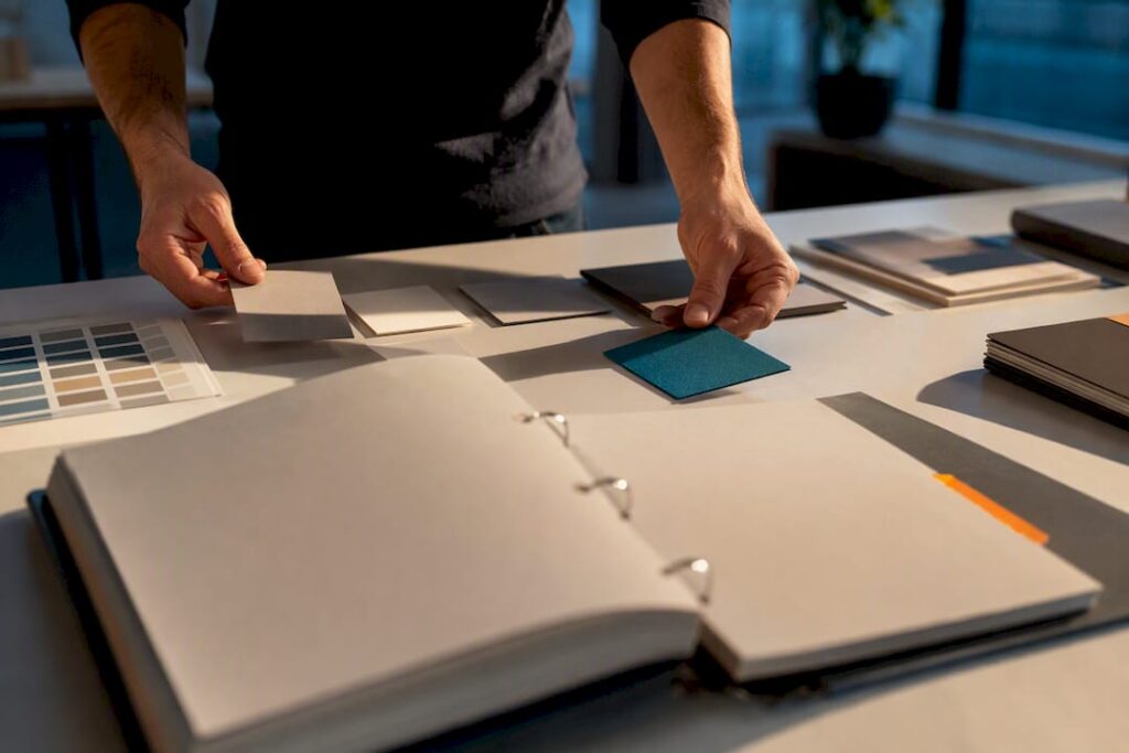 Hands assembling a brand style guide