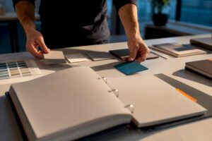 Hands assembling a brand style guide
