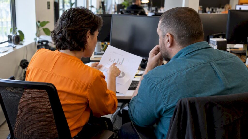 Marketers reviewing an AI budget recommendation