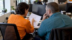 Marketers reviewing an AI budget recommendation
