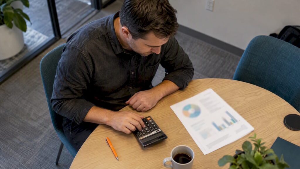 Analyst calculating campaign benchmark costs